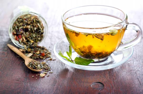 Herbal tea ingredients and a cup of brewed tea