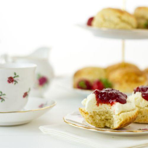 China tea cup and variety of scones set up for English tea time